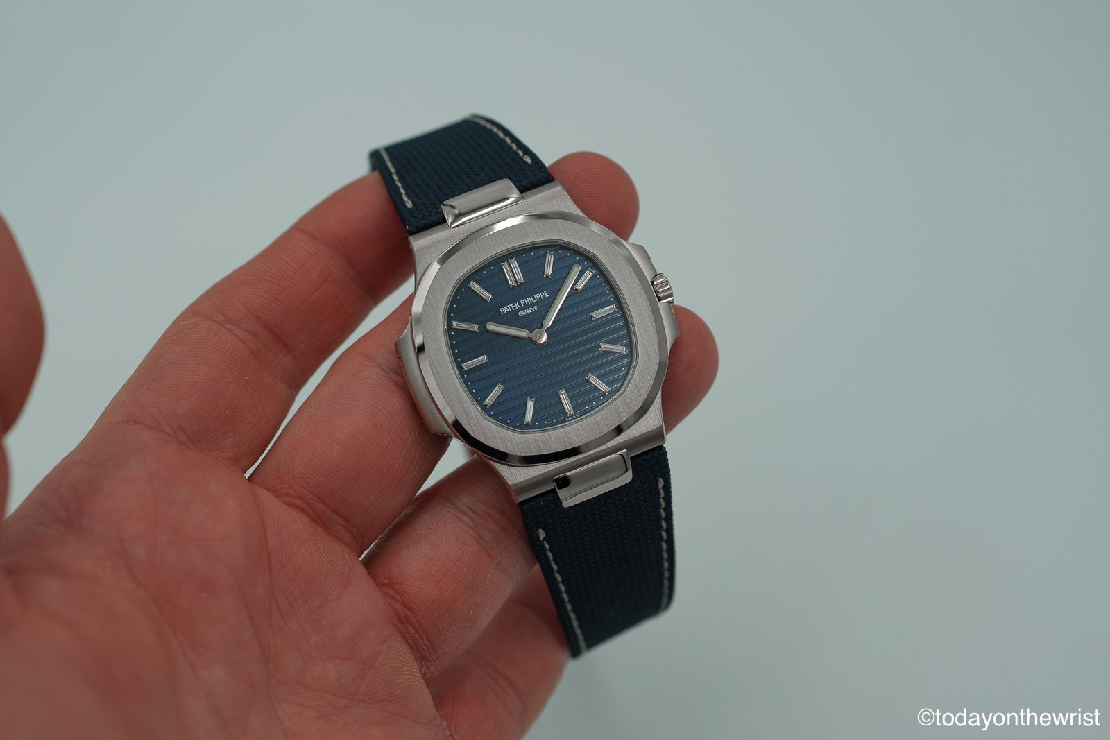 Patek Philippe Nautilus 5810G-001 50th Anniversary white gold watch on navy blue strap